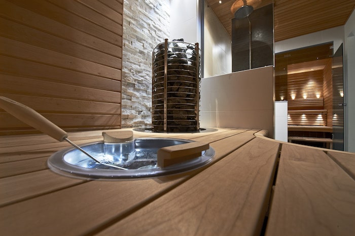 Versatile lighting ensures a comfortable sauna environment.