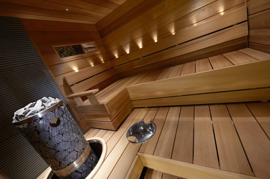 Magnolia panels 15x145 STS on walls and ceiling. Boards Relax, giant chairs. Set of 16-ECO ceiling lights and Sun Sauna water bowl illuminated in a pedestal bath.