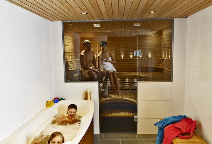 Glass wall brings space to sauna rooms